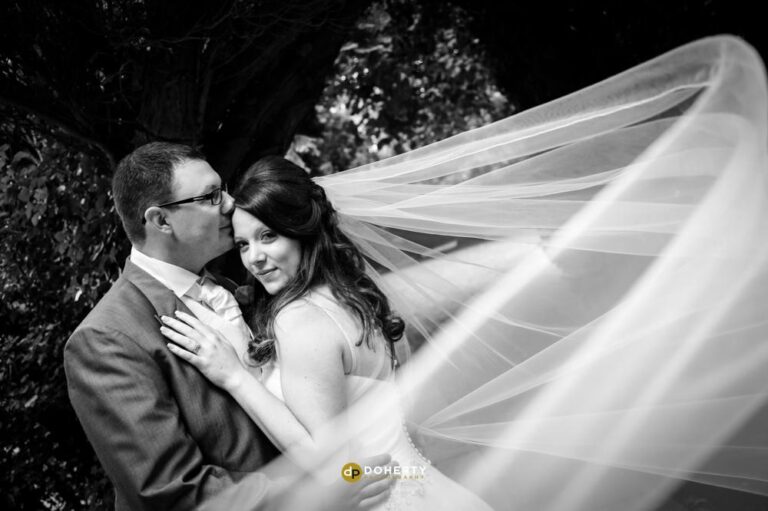 Bride and Groom with veil blowing – Ansty Hall