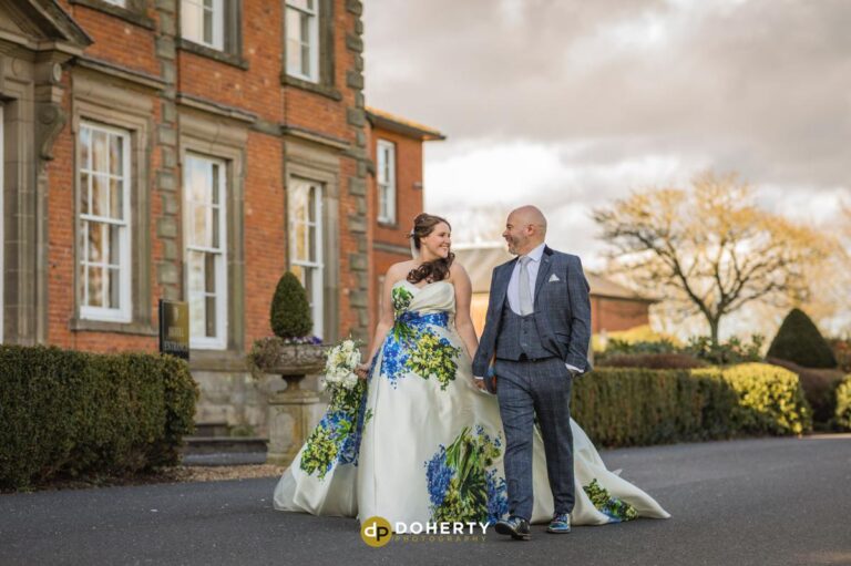 Wedding couple walking outside Ansty Hall